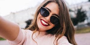 woman with sunglasses smiling