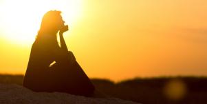 woman sitting in sunset