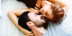 man and woman cuddling