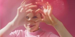 woman in pink channeling her psychic abilities into creativity
