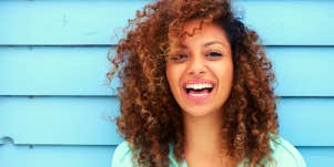 Portrait of a cheerful young woman smiling