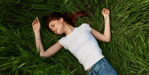 girl laying in grass