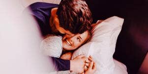 happy couple in bed