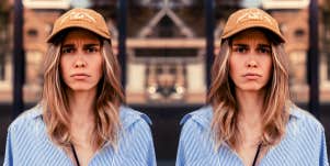 doubled image of woman wearing baseball cap