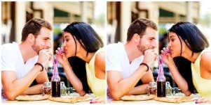 man and woman sharing a soda on a date