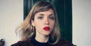 contemplative woman wearing red lipstick