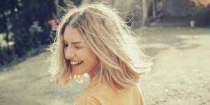 carefree happy woman in a field