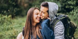couple happy in woods together