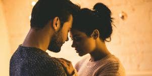 man and woman pressing foreheads