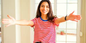woman holding her arms wide open