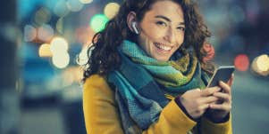 Woman smiling and sending message