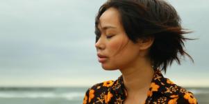 woman grieving by the sea