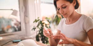 woman painting her nails