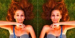 happy woman relaxing on the grass