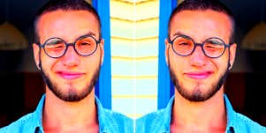 guy squinting into camera thinking about texting again after ghosting someone