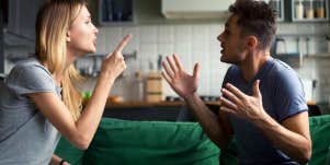 man and woman arguing and pointing fingers