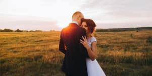 bride and groom hugging