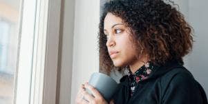 woman looking out the window