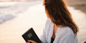 woman holding bible