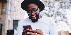 man looking at phone surprised