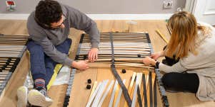 man and woman assembling ikea furniture