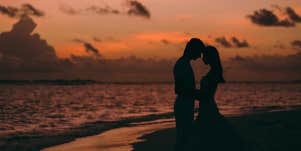 couple in sunset by ocean