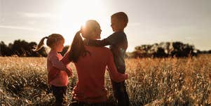 single mom with her two kids in field