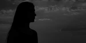 woman alone in the dark