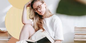 woman reading a good book in comfy clothes