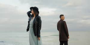 man and woman standing distant from each other