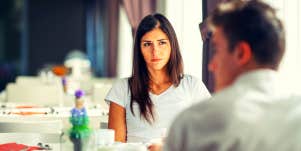 woman looking at her partner wondering why she's not attracted to him anymore