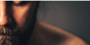 man looking down because he is ashamed of himself for not being attracted to his wife anymore
