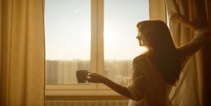 woman looking out window