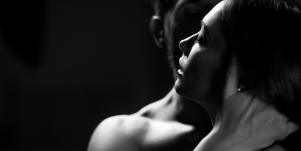 man and woman embracing in passion