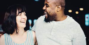 Mixed-race couple smiling and laughing together