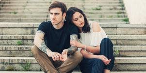 man and woman sitting on stairs