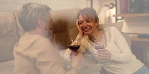 Man and woman drinking wine on couch