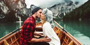 couple kissing on a boat