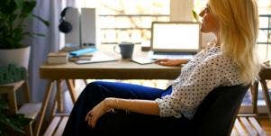 working woman sitting at her desk