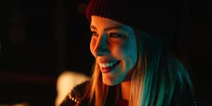 smiling woman at night