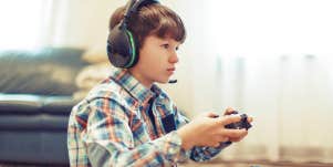 little boy playing a video game