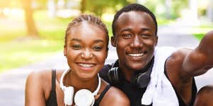 Man and woman smiling after workout together