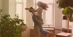 Man lifting woman into the air