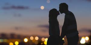 couple kissing at night