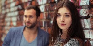 man and woman looking at camera