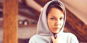 woman in hoodie with low self-esteem