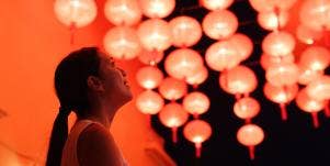 woman looking at chinese lanterns