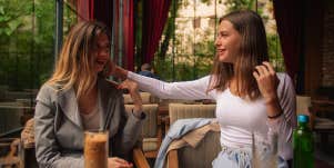 two women having coffee together