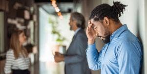 male worker reacting to bad news