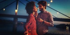 man and woman dancing at dusk